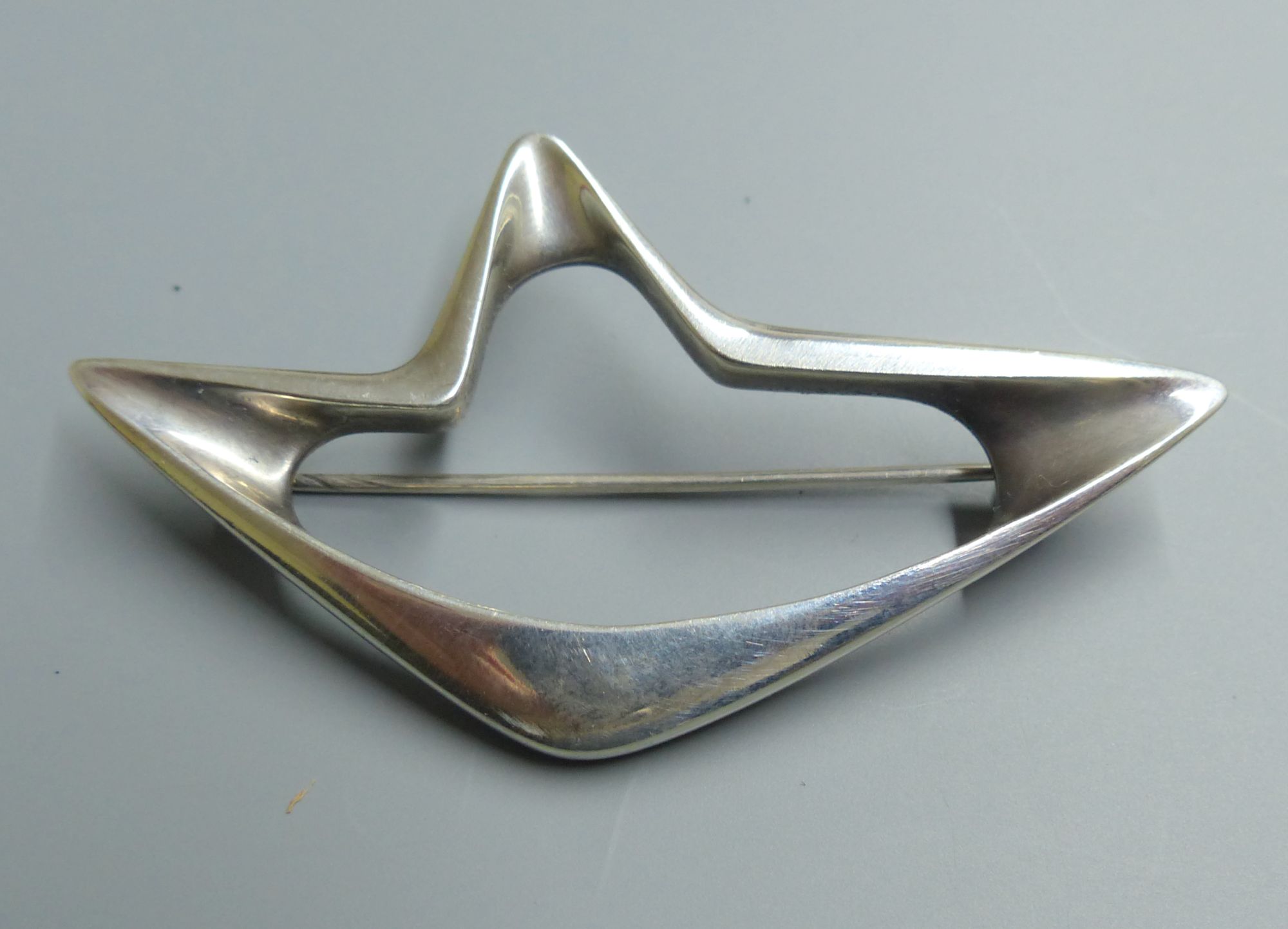 A Georg Jensen sterling abstract brooch, designed by Henning Koppel, no. 376, 67mm.
